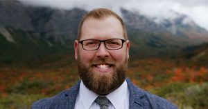 Parker Nielsen, caucasin male with red beard and glasses