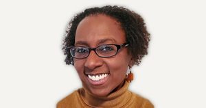 Tamika Hughes, an African American woman wearing glasses