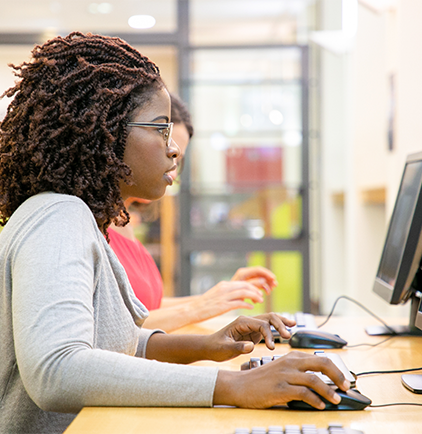 Person of colour using a computer